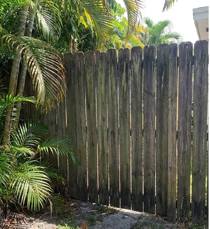 Wood fence restoration before pressure washing Miami